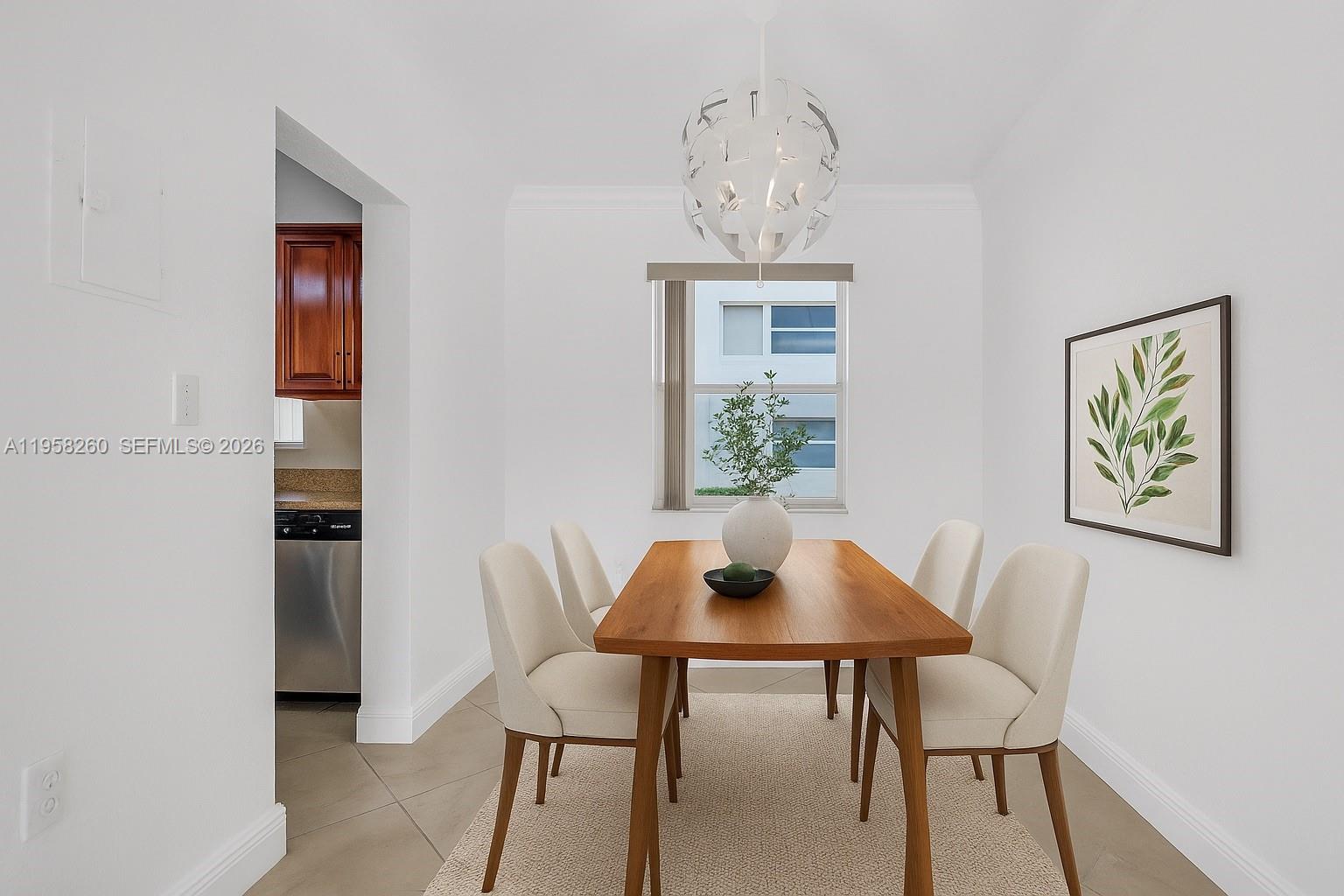 8601 Southwest 94th Street, Unit 104W Miami, FL 33156 - Photo 4 of 29 a view of a dining room with furniture and window