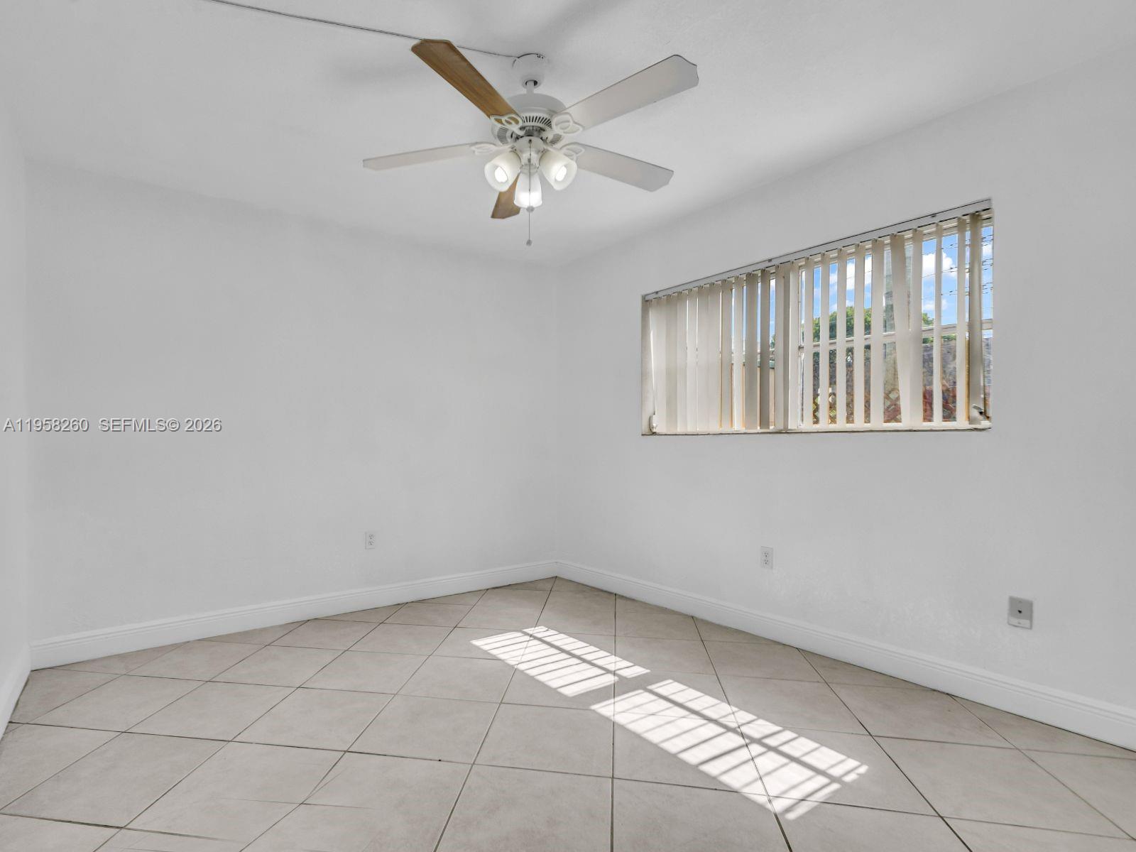 8601 Southwest 94th Street, Unit 104W Miami, FL 33156 - Photo 10 of 29 a view of an empty room with a window
