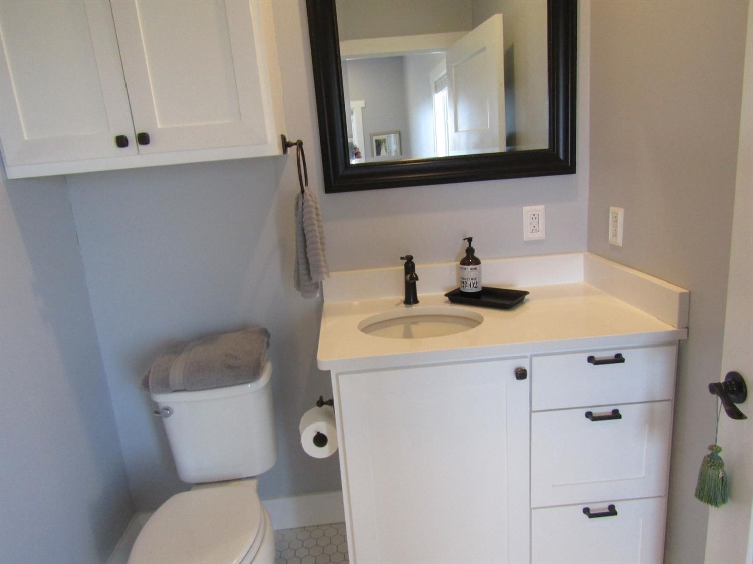 3370 Drill Stem Road Levelland, TX 79336 - Photo 12 of 38 a bathroom with a sink toilet and mirror