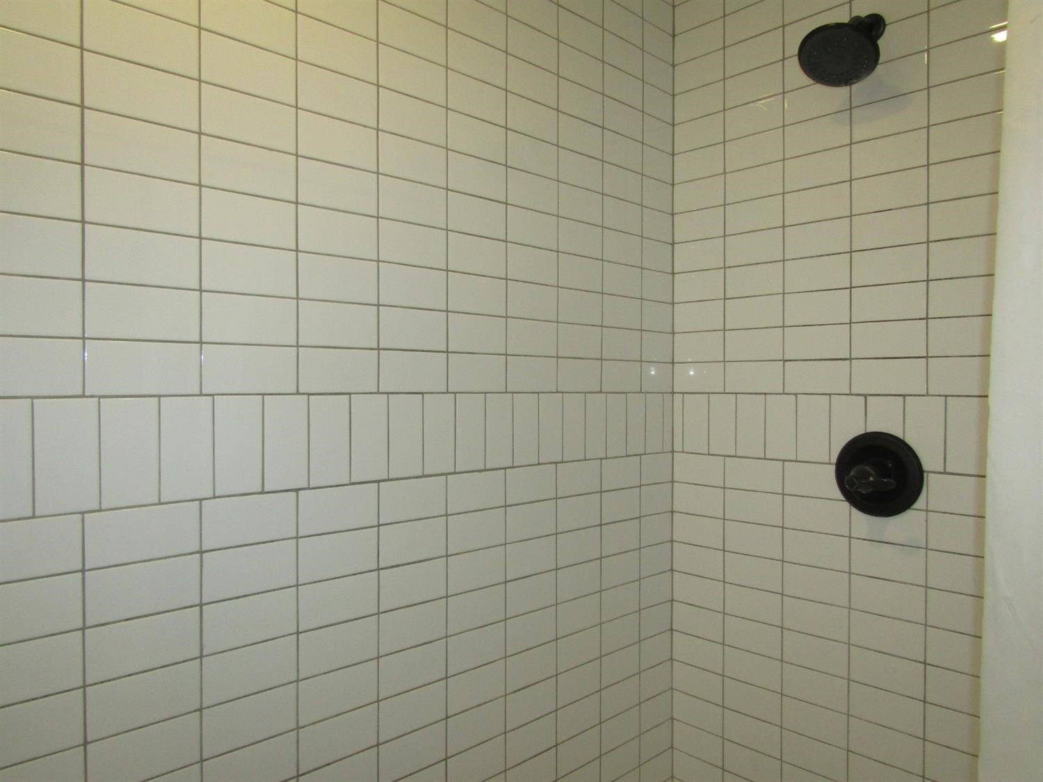 3370 Drill Stem Road Levelland, TX 79336 - Photo 13 of 38 a bathroom with a shower