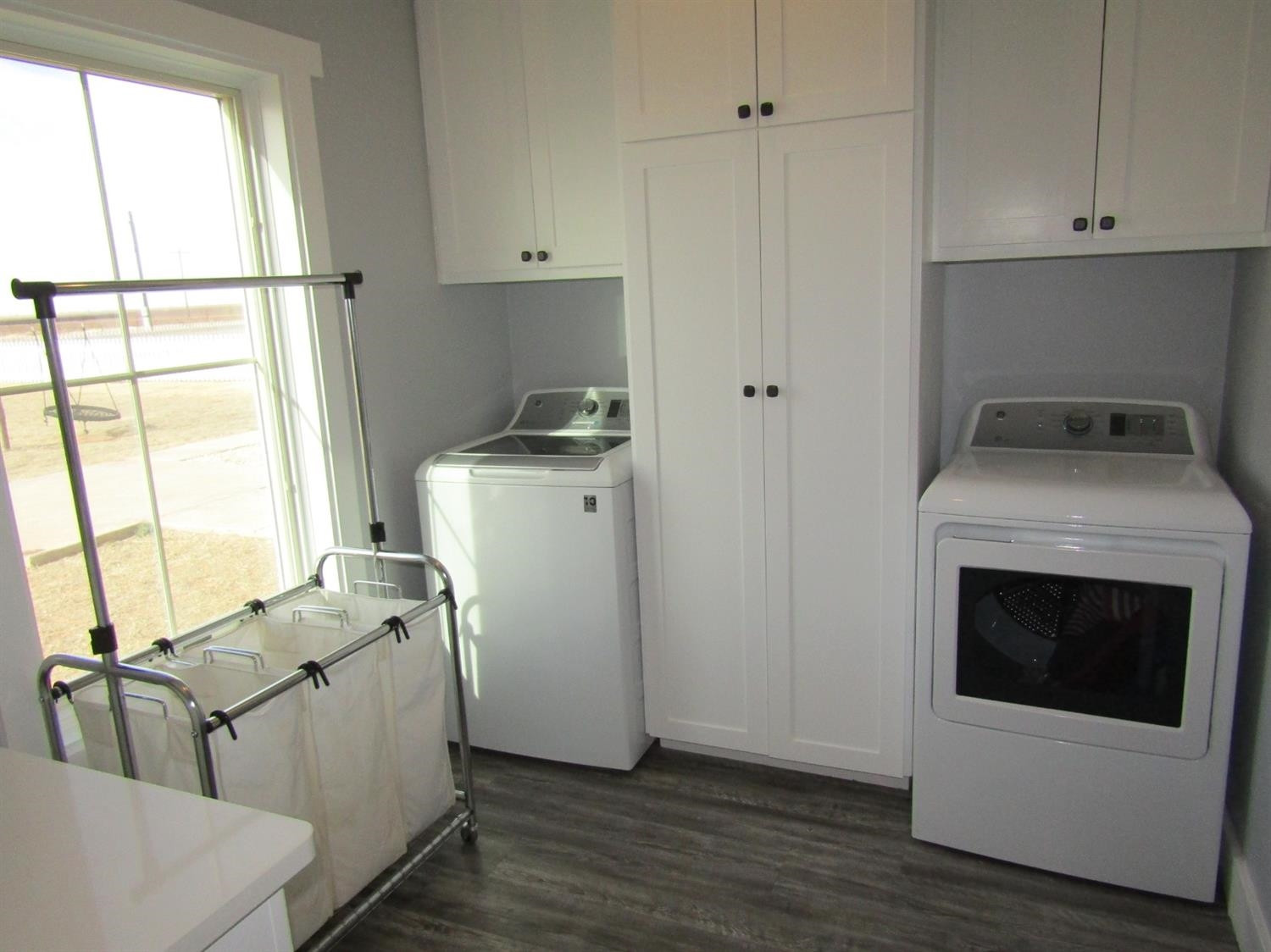 3370 Drill Stem Road Levelland, TX 79336 - Photo 16 of 38 a room with storage and utility