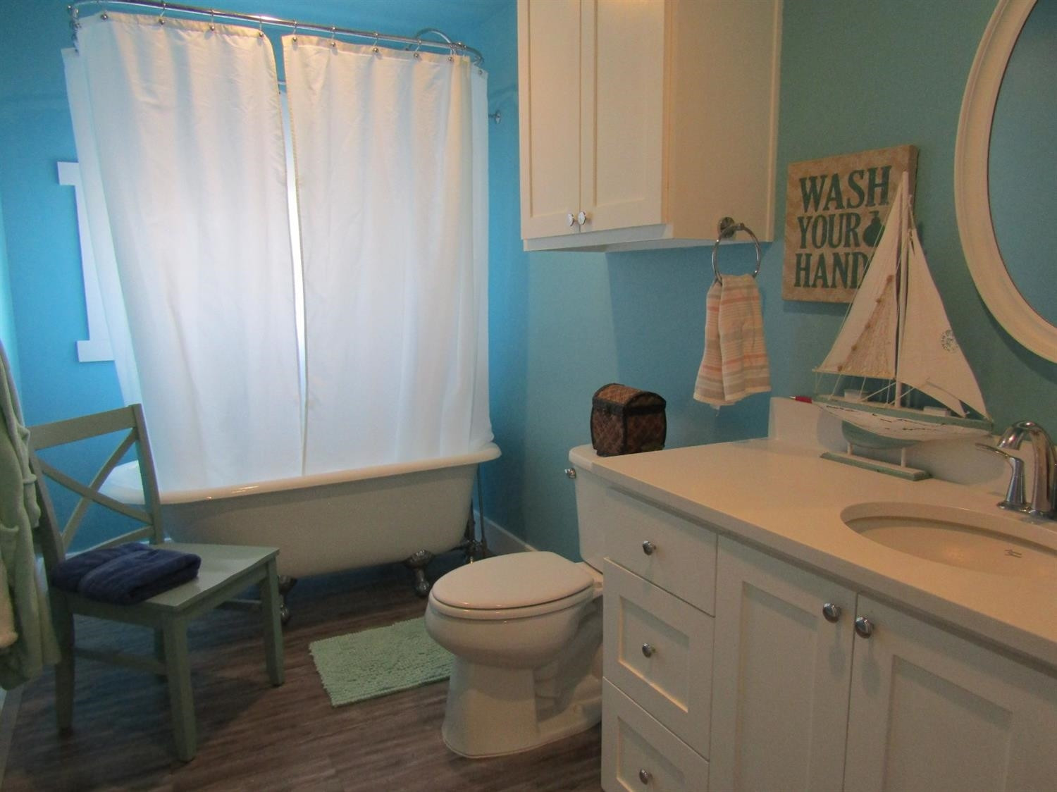 3370 Drill Stem Road Levelland, TX 79336 - Photo 22 of 38 a bathroom with a sink toilet and a mirror