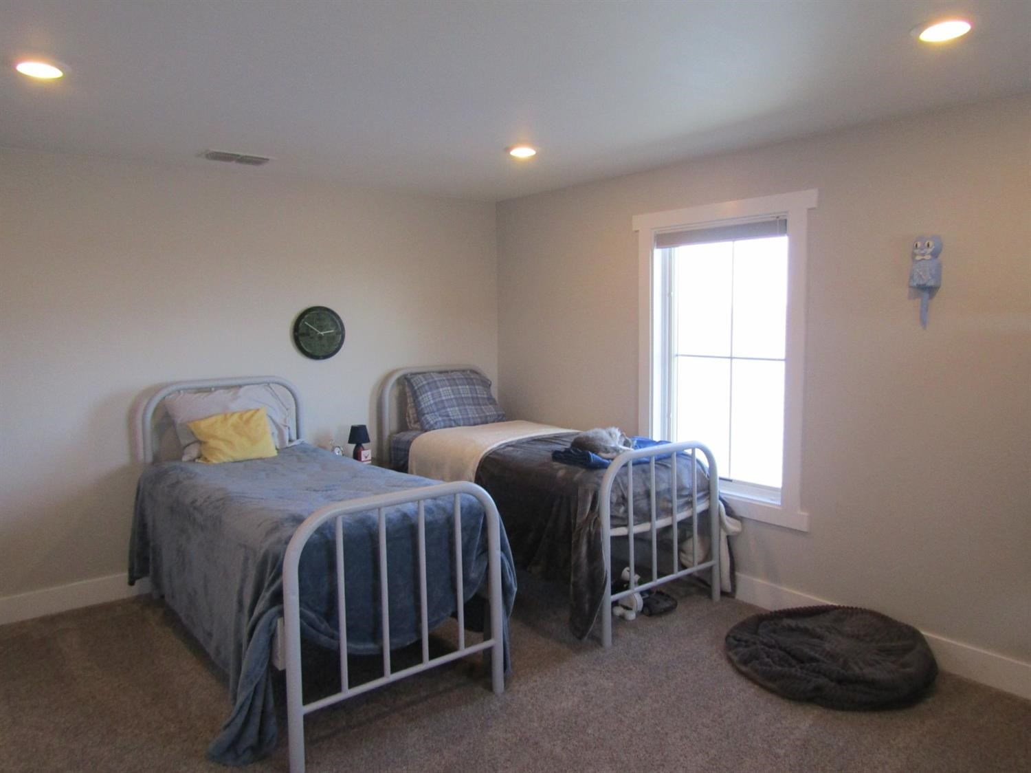 3370 Drill Stem Road Levelland, TX 79336 - Photo 23 of 38 a bedroom with two beds and a window