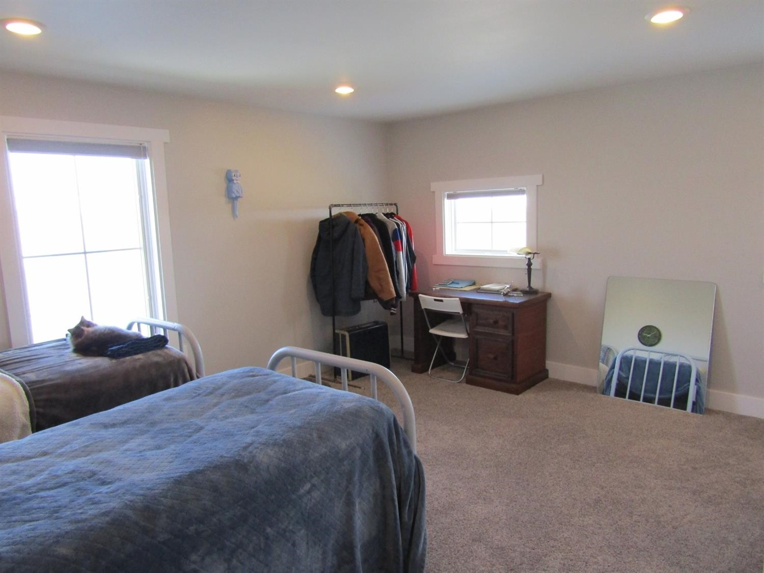 3370 Drill Stem Road Levelland, TX 79336 - Photo 24 of 38 a bedroom with bed and a chandelier