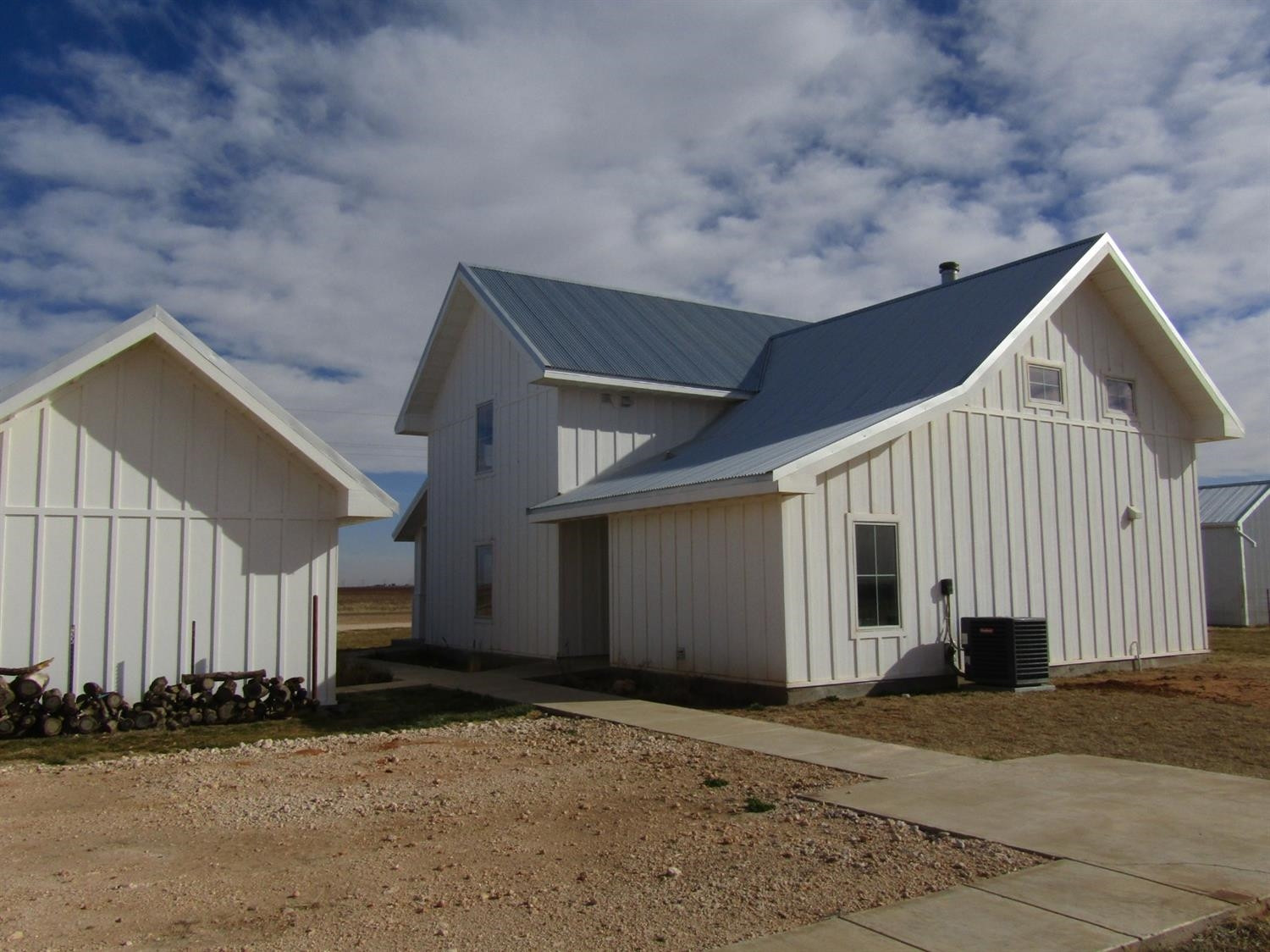 3370 Drill Stem Road Levelland, TX 79336 - Photo 27 of 38 a view of a house with a yard and garage