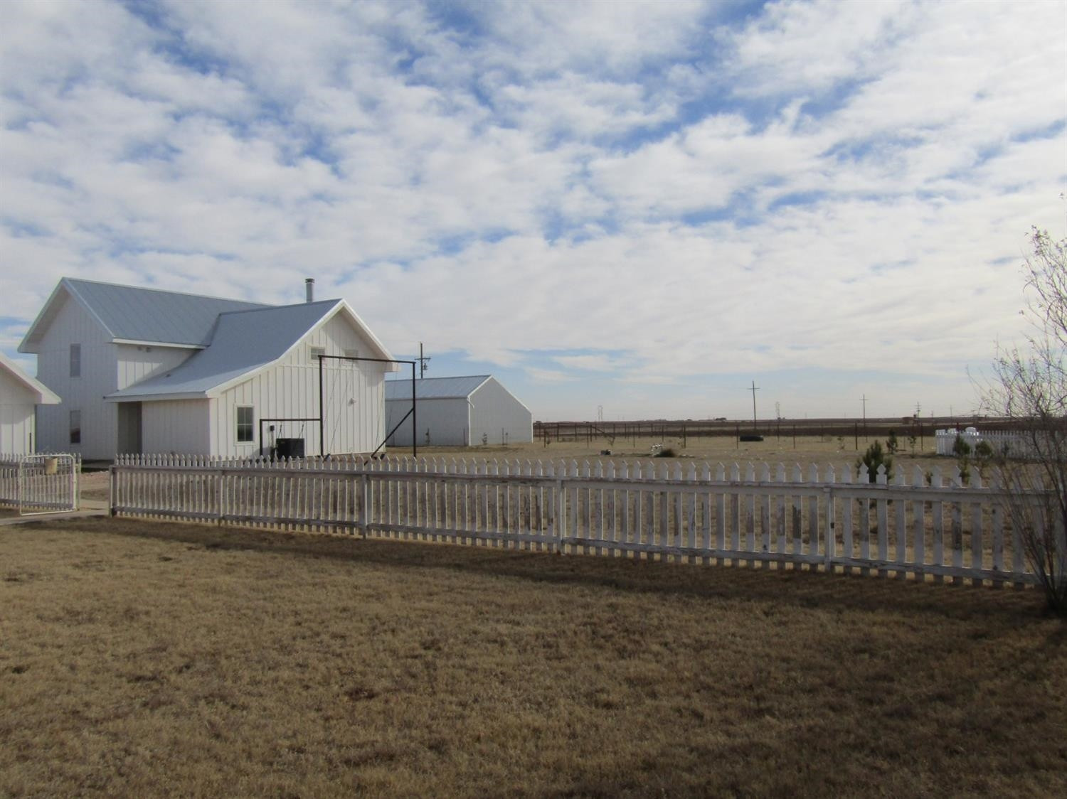 3370 Drill Stem Road Levelland, TX 79336 - Photo 28 of 38 a view of house with wooden fence