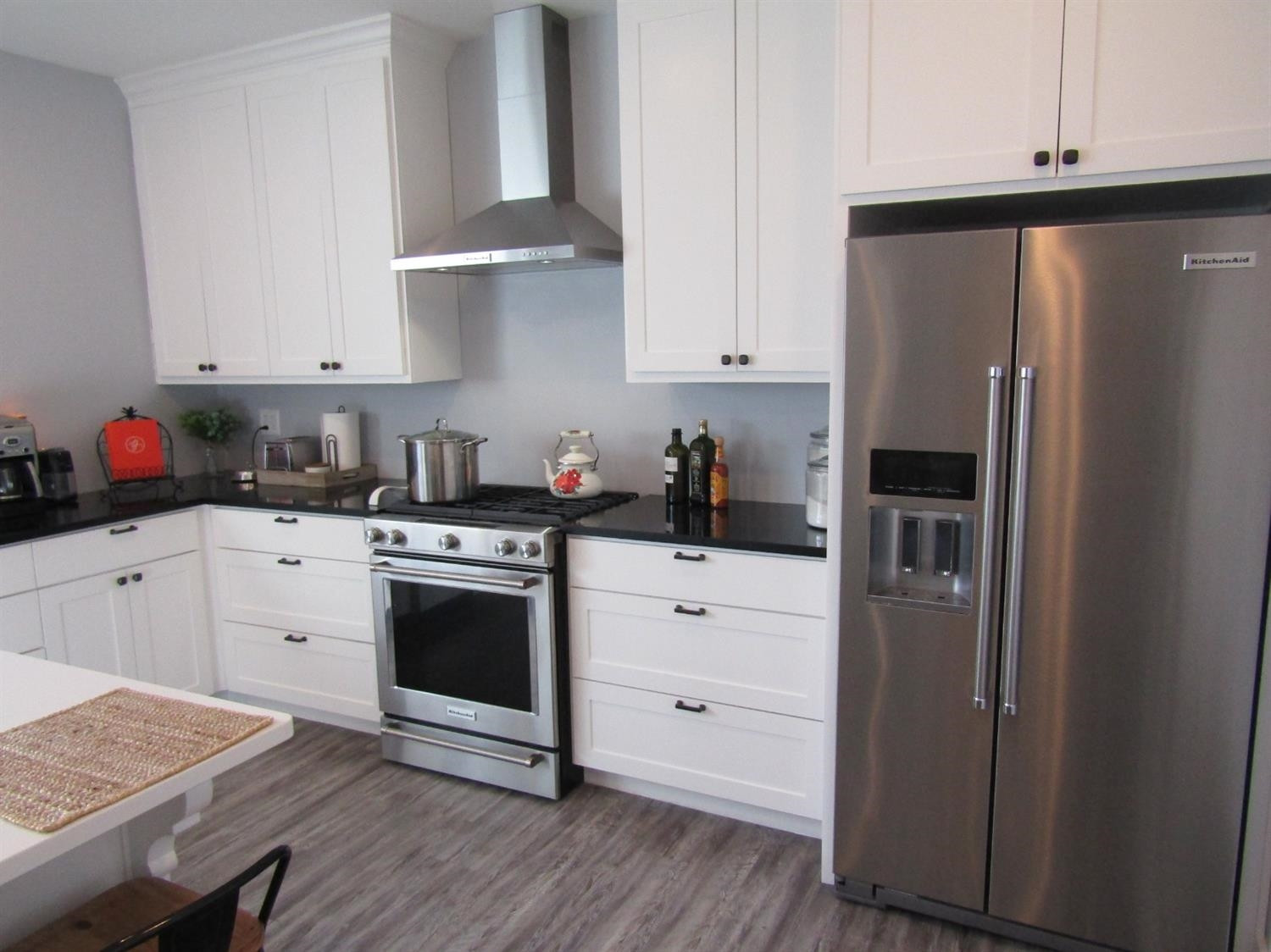 3370 Drill Stem Road Levelland, TX 79336 - Photo 7 of 38 a kitchen with stainless steel appliances white cabinets and a refrigerator