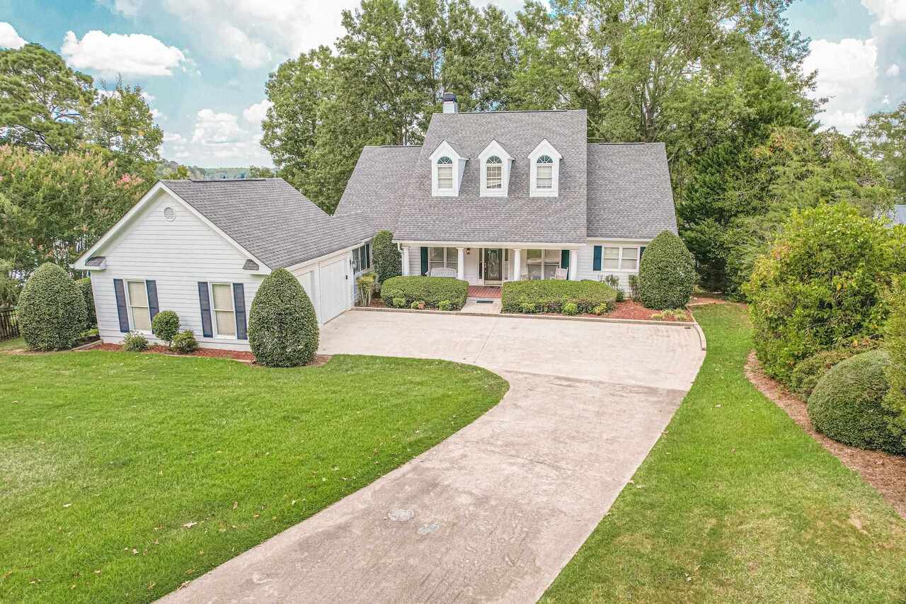 180 Hickory Point Buckhead, GA 30625 - Photo 1 of 1 a view of a house with a yard