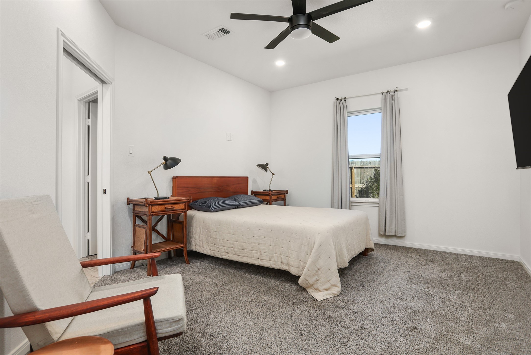 3403 Daisy Santa Fe, TX 77510 - Photo 10 of 25 a bedroom with a bed and a chandelier