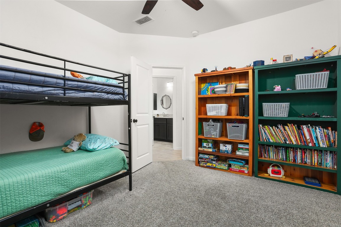 3403 Daisy Santa Fe, TX 77510 - Photo 15 of 25 a bedroom with furniture and book shelf