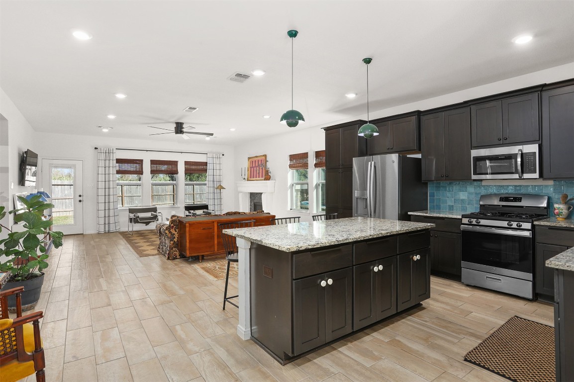 3403 Daisy Santa Fe, TX 77510 - Photo 3 of 25 a kitchen with stainless steel appliances granite countertop a stove a sink dishwasher a refrigerator and a oven