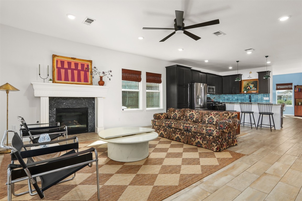3403 Daisy Santa Fe, TX 77510 - Photo 6 of 25 a living room with furniture a dining table and a fireplace