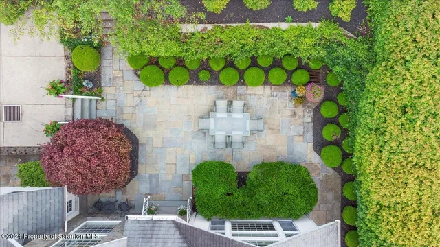 a kitchen with a stove and white cabinets