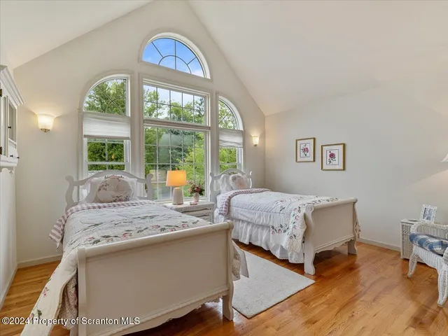 a spacious bathroom with sinks mirror and a bathtub