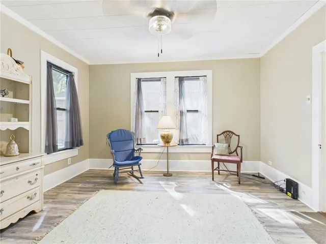 a living room with a couch and a window