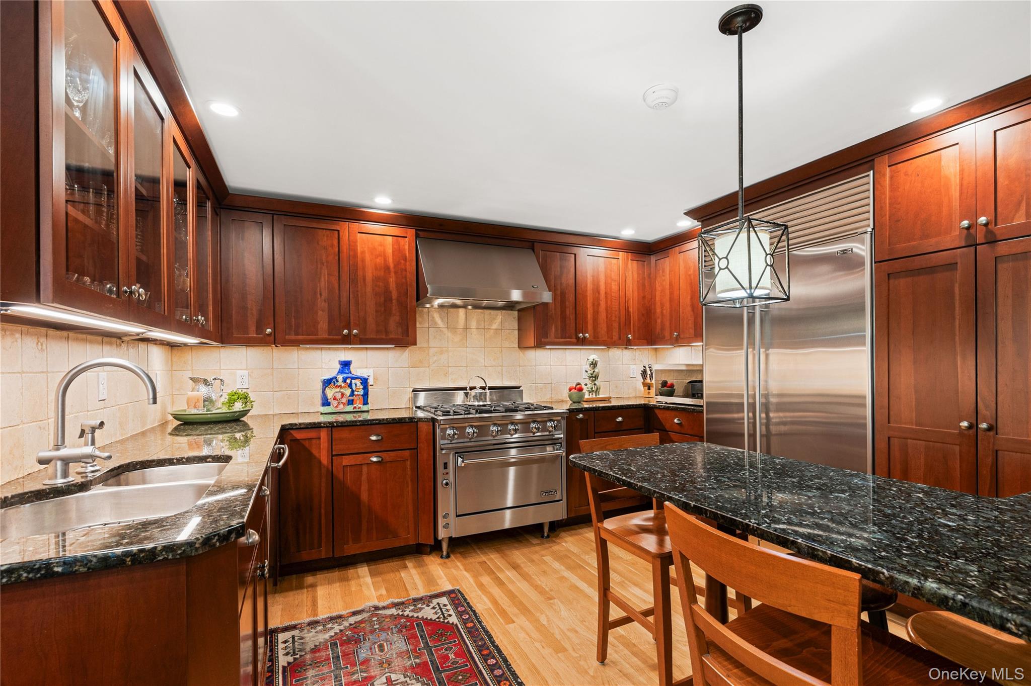 46 Hill Street Rye, NY 10580 - Photo 18 of 30 a kitchen with stainless steel appliances granite countertop a sink stove and refrigerator