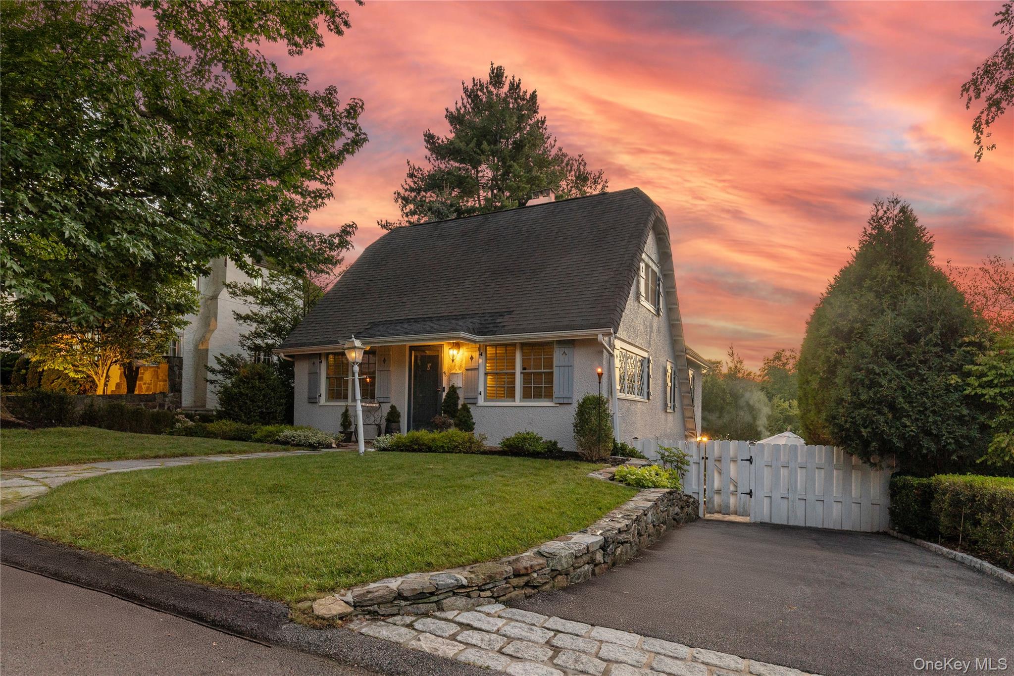 46 Hill Street Rye, NY 10580 - Photo 2 of 30 a view of a white house with a yard
