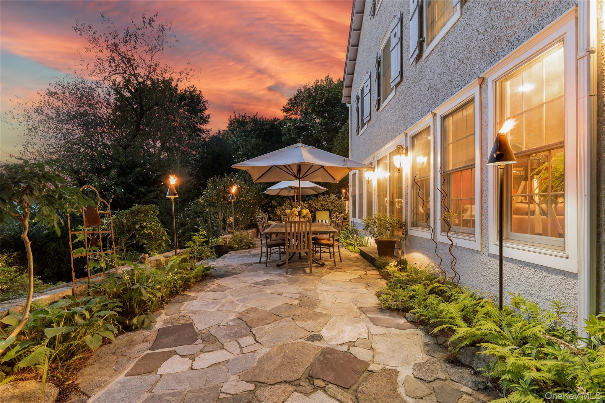 46 Hill Street Rye, NY 10580 - Photo 23 of 30 a view of a patio with table and chairs and potted plants