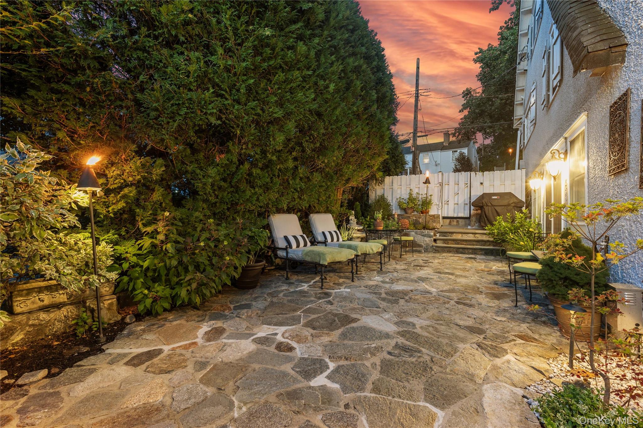 46 Hill Street Rye, NY 10580 - Photo 25 of 30 a bench is sitting in middle of a yard