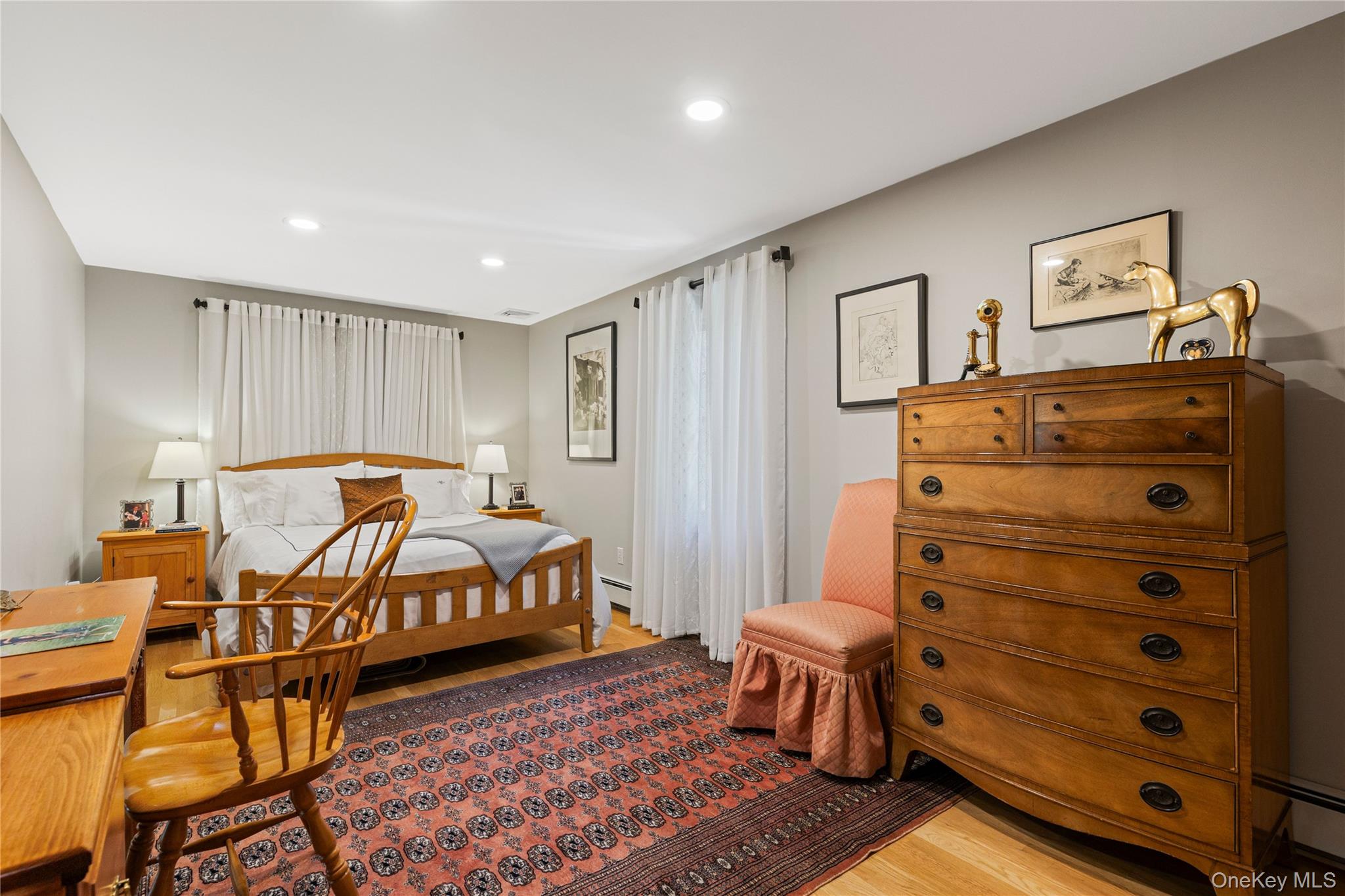 46 Hill Street Rye, NY 10580 - Photo 8 of 30 a bedroom with a bed and wooden floor