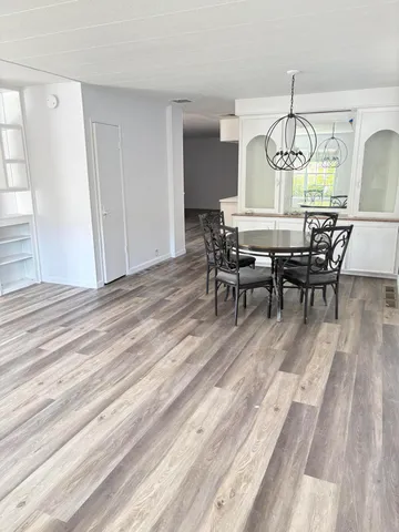 a kitchen with a stove a sink and a refrigerator