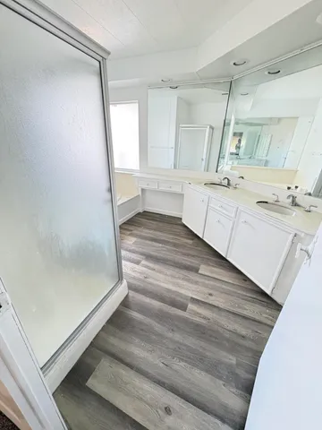 a bathroom with a bathtub and a sink