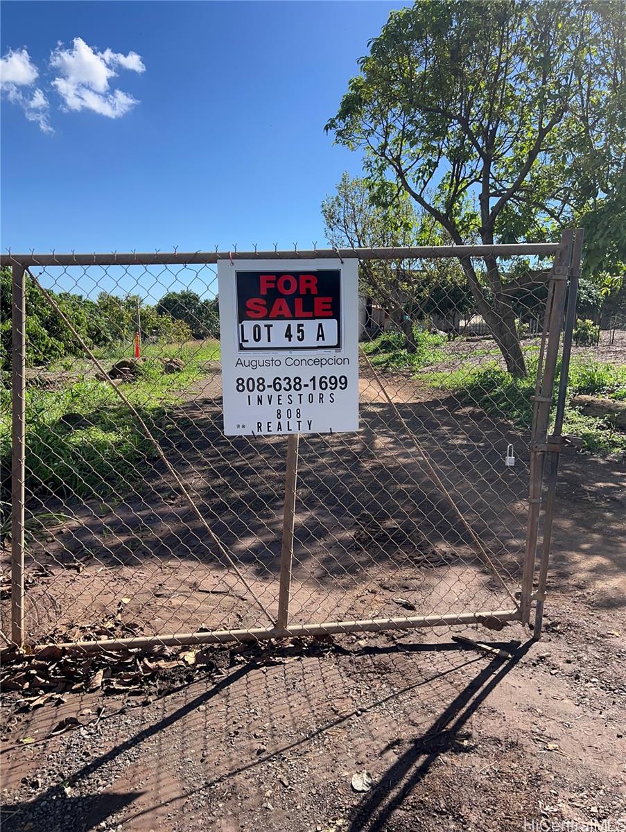 94-1100 Kunia Road, Unit 45B Waipahu, HI 96797 - Photo 9 of 13 a sign on the side of a road