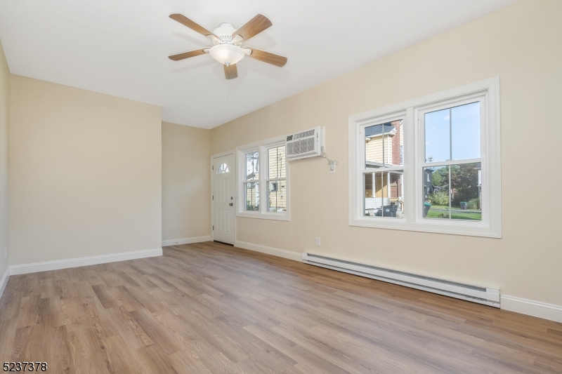 13 Maple Street Milford, NJ 08848 - Photo 5 of 20 wooden floor in an empty room with a window