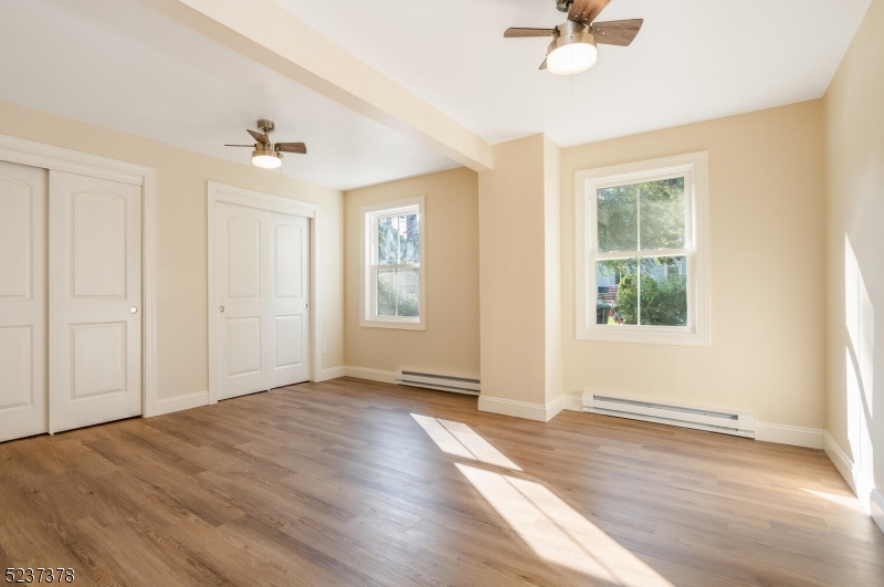 13 Maple Street Milford, NJ 08848 - Photo 8 of 20 wooden floor in an empty room with a window