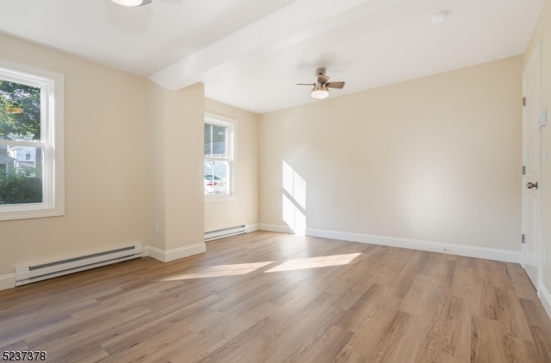 13 Maple Street Milford, NJ 08848 - Photo 9 of 20 wooden floor in an empty room with a window
