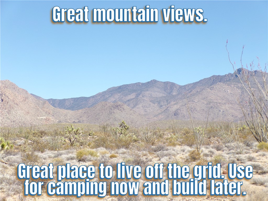 244-06-263 East Joshua Road Yucca, AZ 86438 - Photo 1 of 7 a view of a street with a mountain in the background