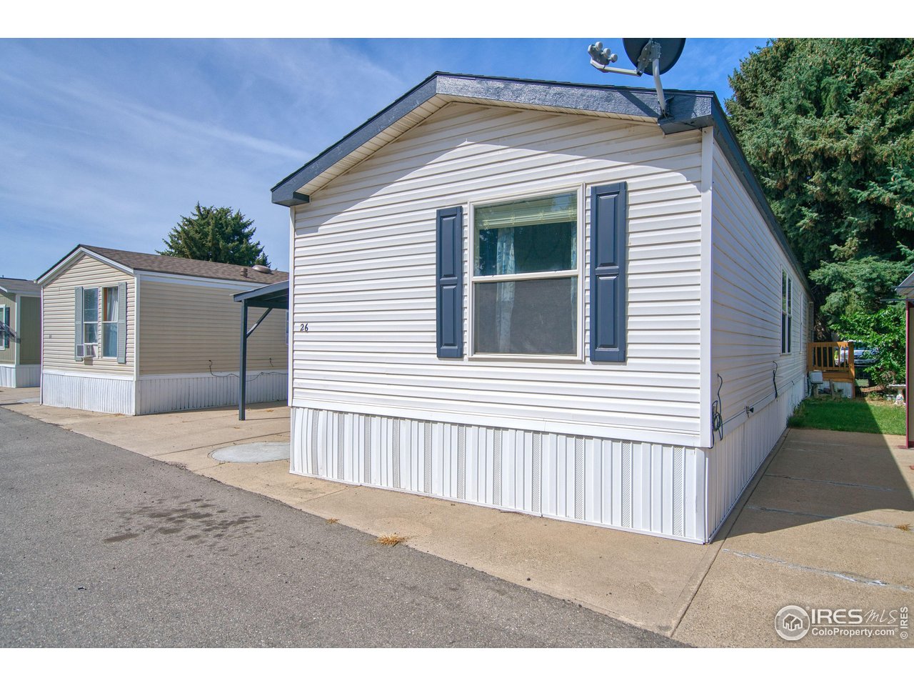 230 North 2nd Street, Unit 26 Berthoud, CO 80513 - Photo 16 of 17 a view of a house with a outdoor space