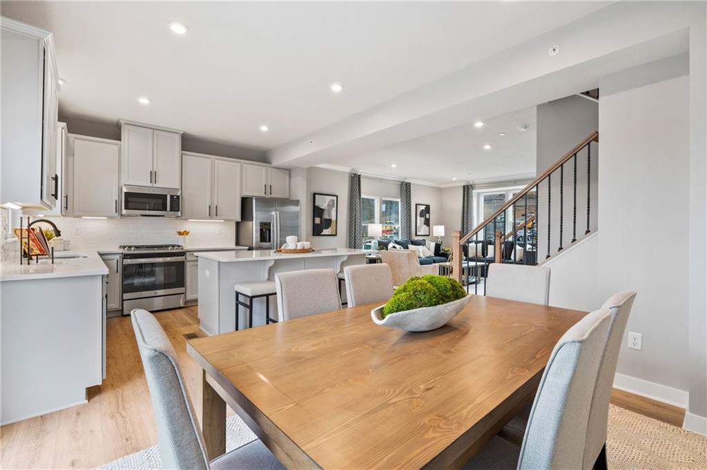 6031 Ruby Way Mars, PA 16046 - Photo 2 of 10 a kitchen with kitchen island a stove a table and chairs