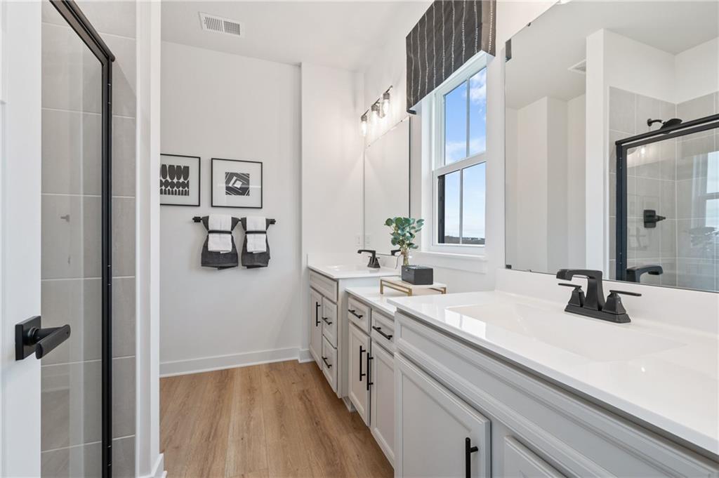 6031 Ruby Way Mars, PA 16046 - Photo 7 of 10 a bathroom with a sink and a mirror