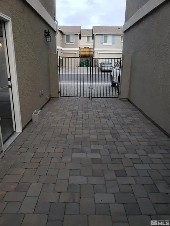 a view of a porch with wooden floor and fence