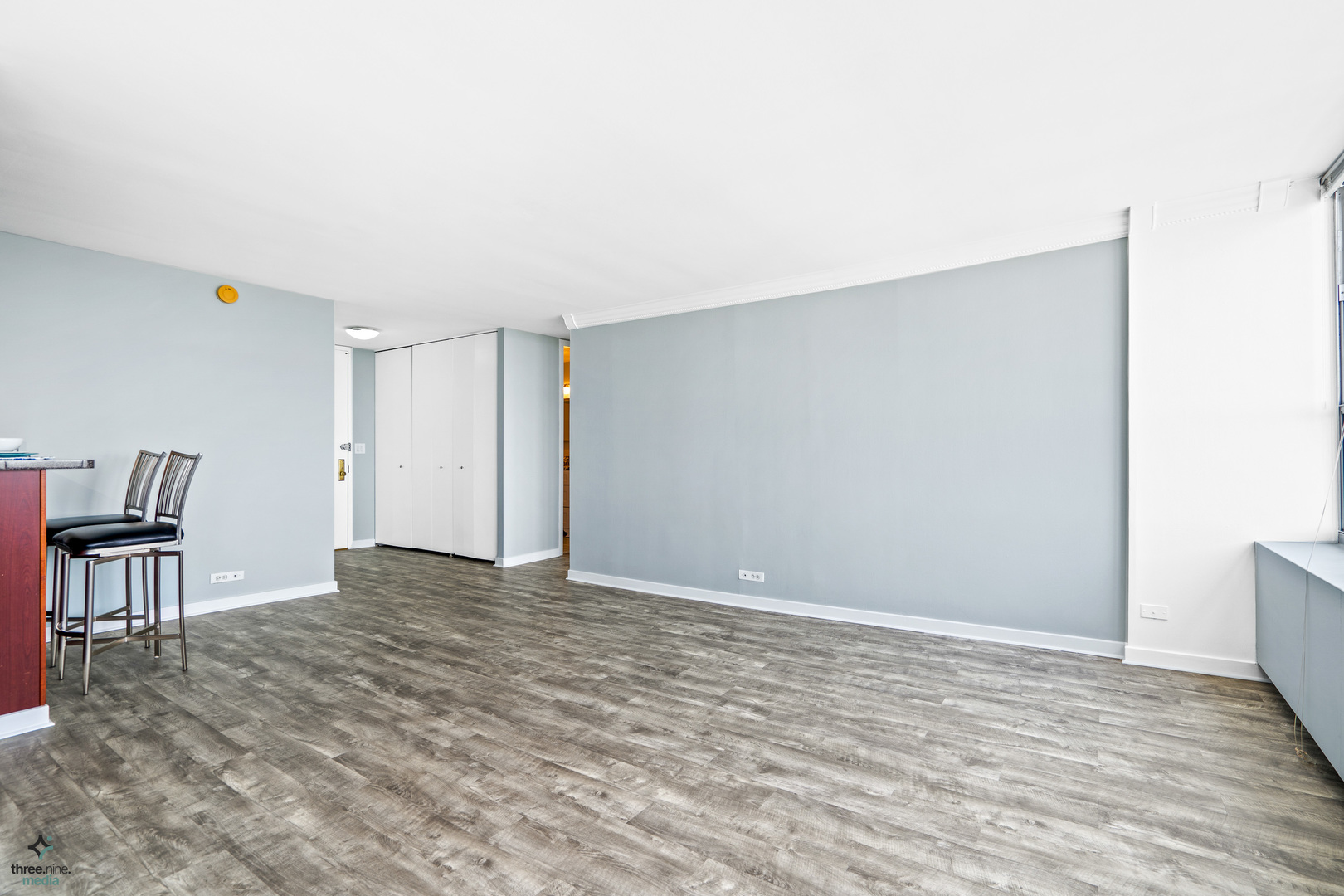 655 West Irving Park Road, Unit 3214 Chicago, IL 60613 - Photo 16 of 37 a view of an empty room with a window