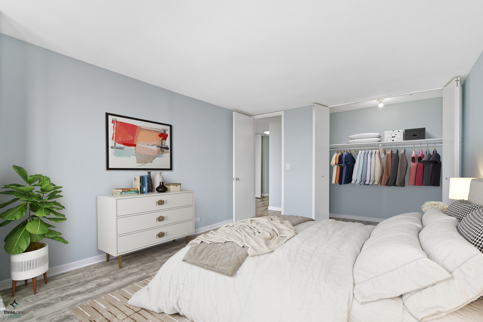 655 West Irving Park Road, Unit 3214 Chicago, IL 60613 - Photo 21 of 37 a bedroom with a bed and a couch