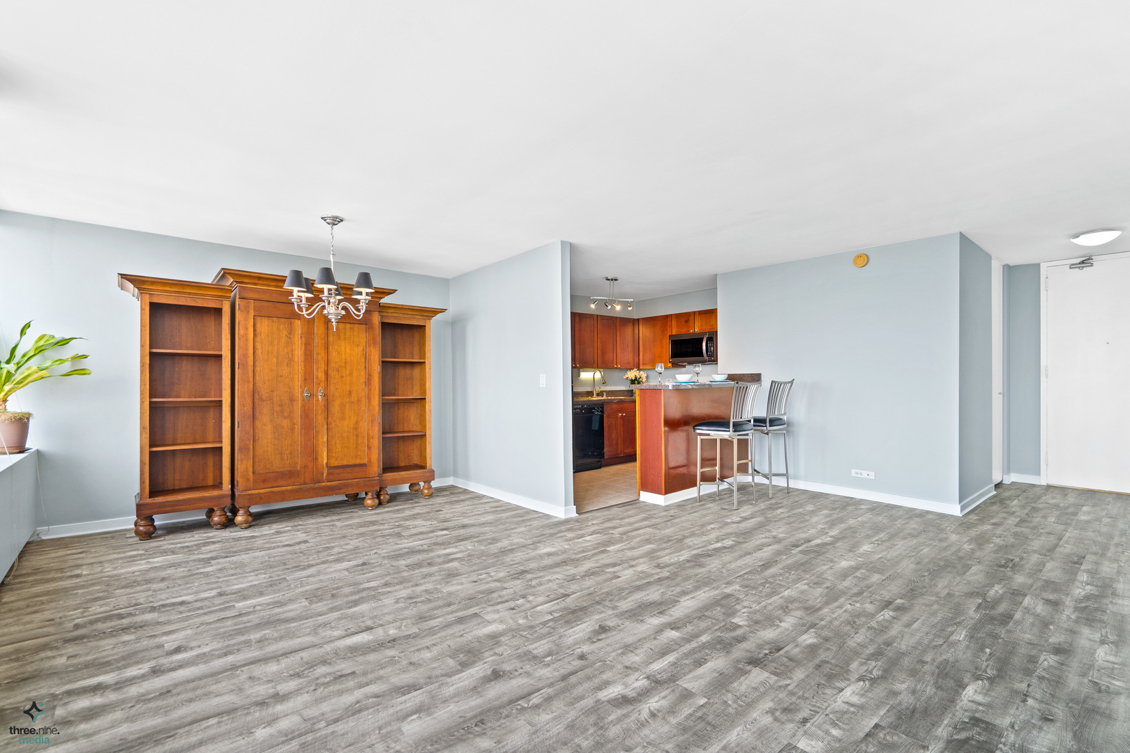 655 West Irving Park Road, Unit 3214 Chicago, IL 60613 - Photo 9 of 37 a view of a livingroom with furniture and an empty room