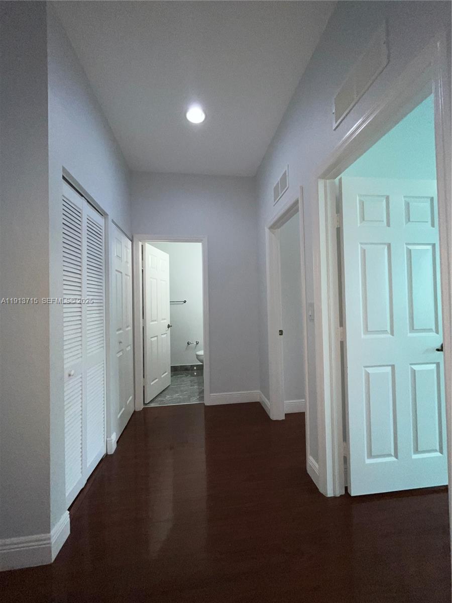 4929 Southwest 140th Terrace, Unit 5 Miramar, FL 33027 - Photo 14 of 42 an empty room with wooden floor