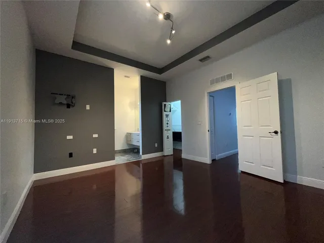 a bathroom with a double vanity sink and mirror