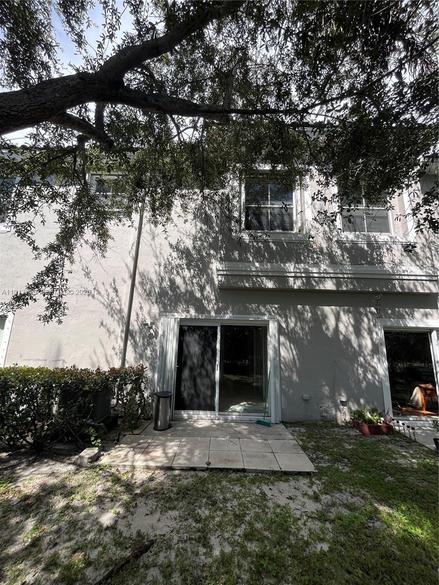 4929 Southwest 140th Terrace, Unit 5 Miramar, FL 33027 - Photo 25 of 42 a front view of a house with a yard