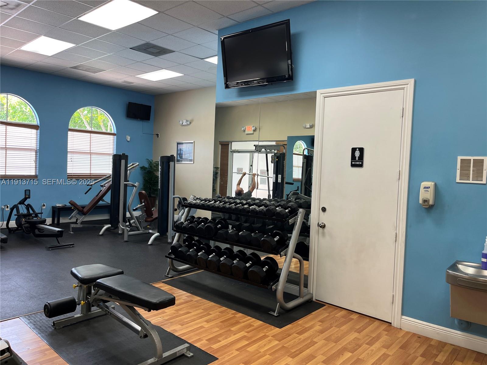 4929 Southwest 140th Terrace, Unit 5 Miramar, FL 33027 - Photo 29 of 42 a room with gym equipment and a window