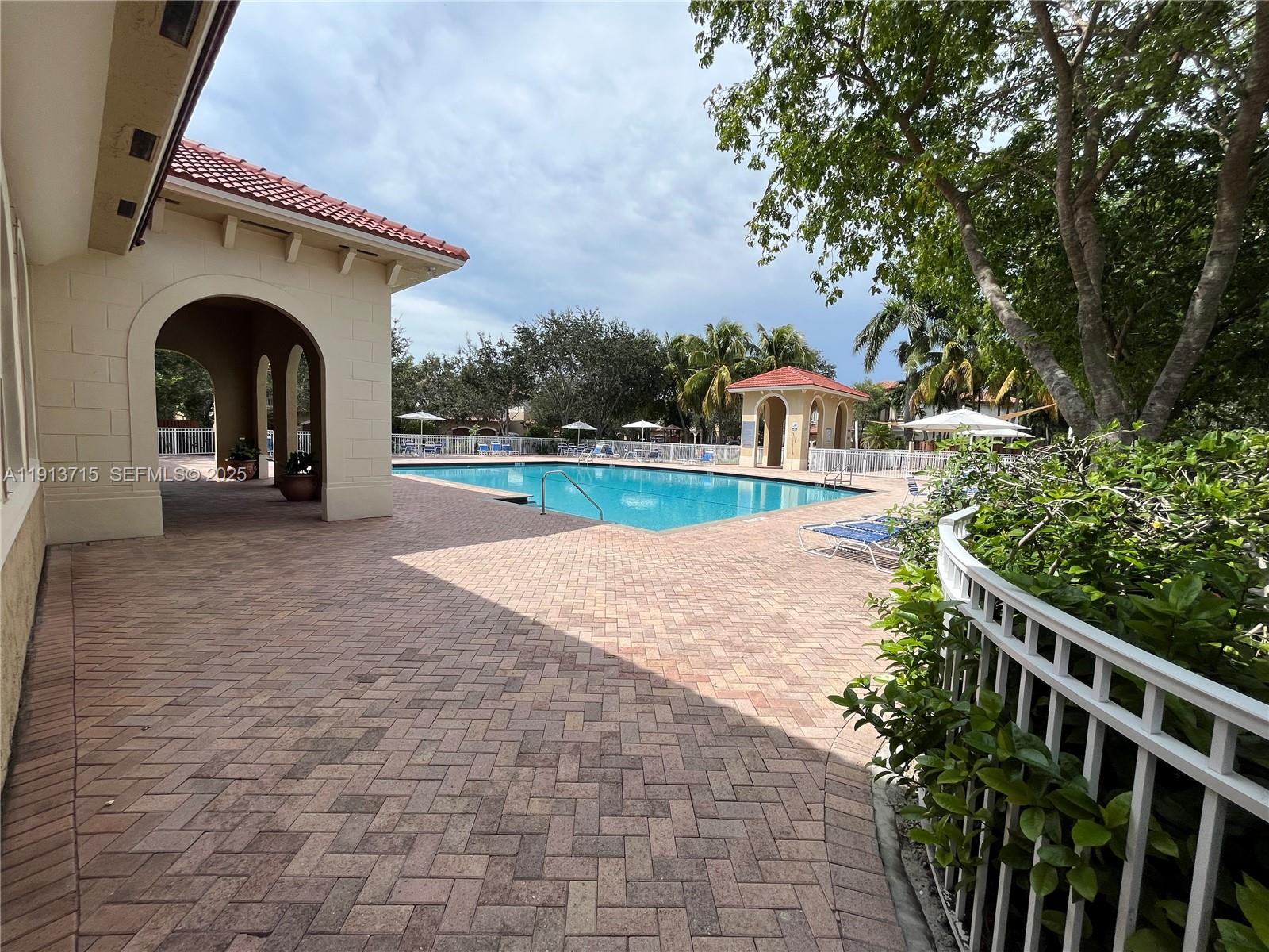 4929 Southwest 140th Terrace, Unit 5 Miramar, FL 33027 - Photo 31 of 42 a view of house with outdoor space and yard