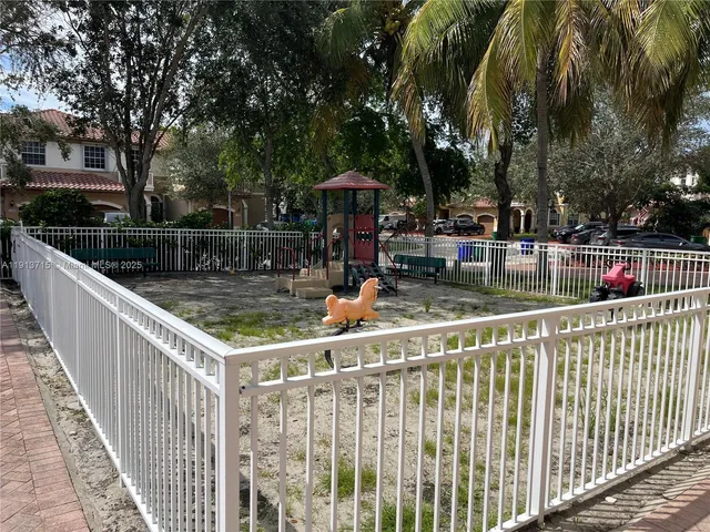 a view of a dining room kitchen and a wooden floor