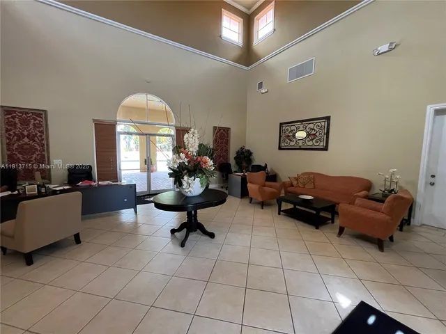 a view of a livingroom with furniture and tables