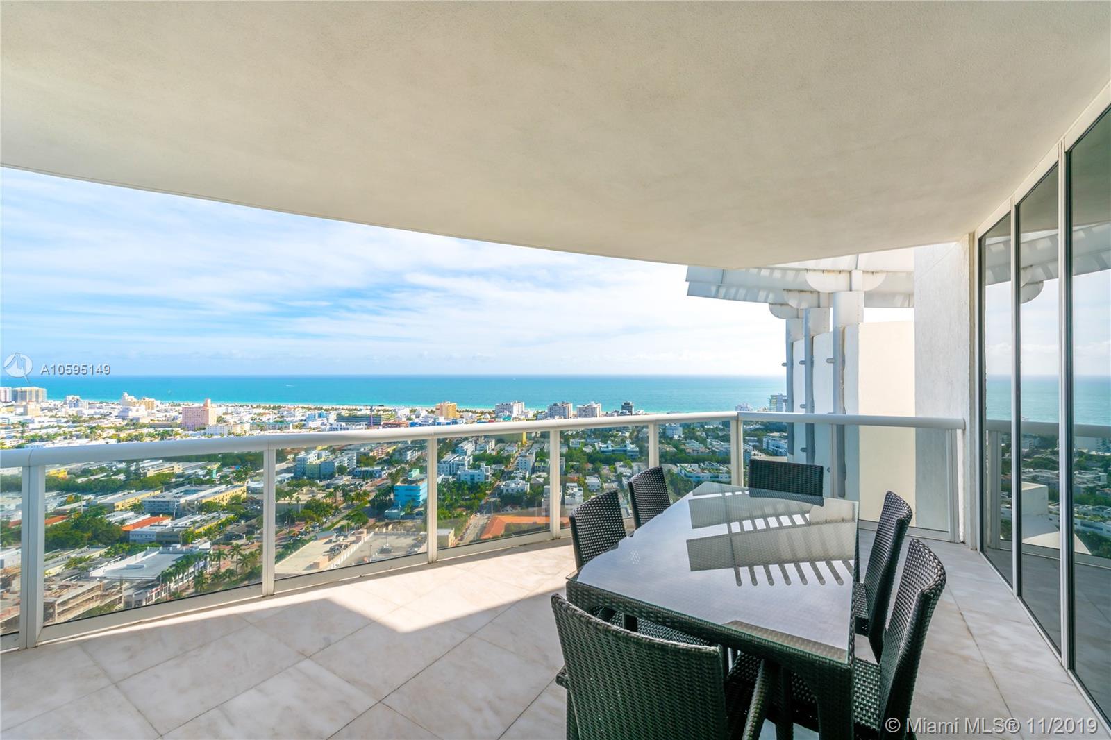 400 Alton Road, Unit 3403 Miami Beach, FL 33139 - Photo 2 of 10 a view of a chairs and table in patio