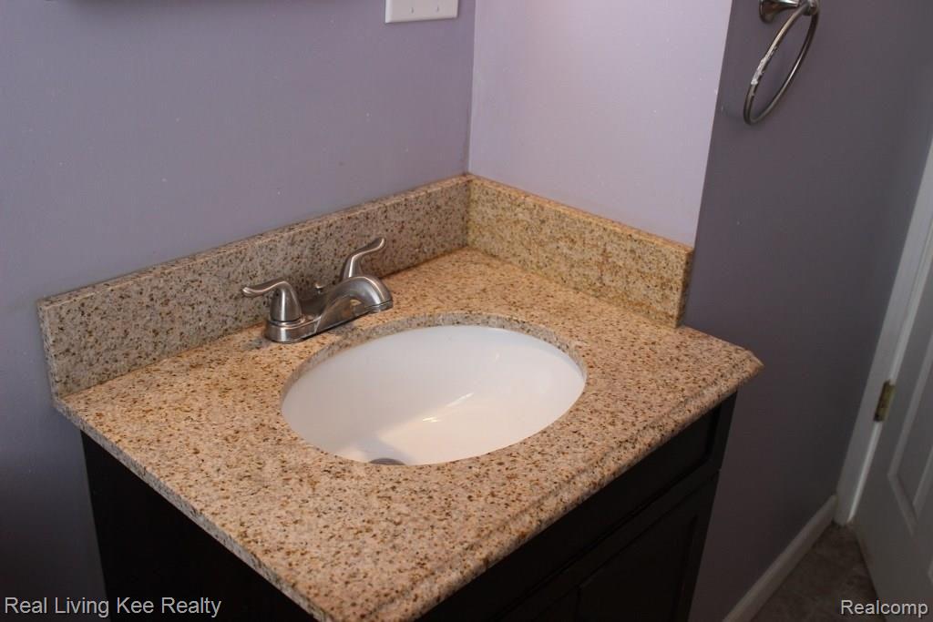 3512 Normandy Road Royal Oak, MI 48073 - Photo 13 of 18 Granite countertop in main bathroom.
