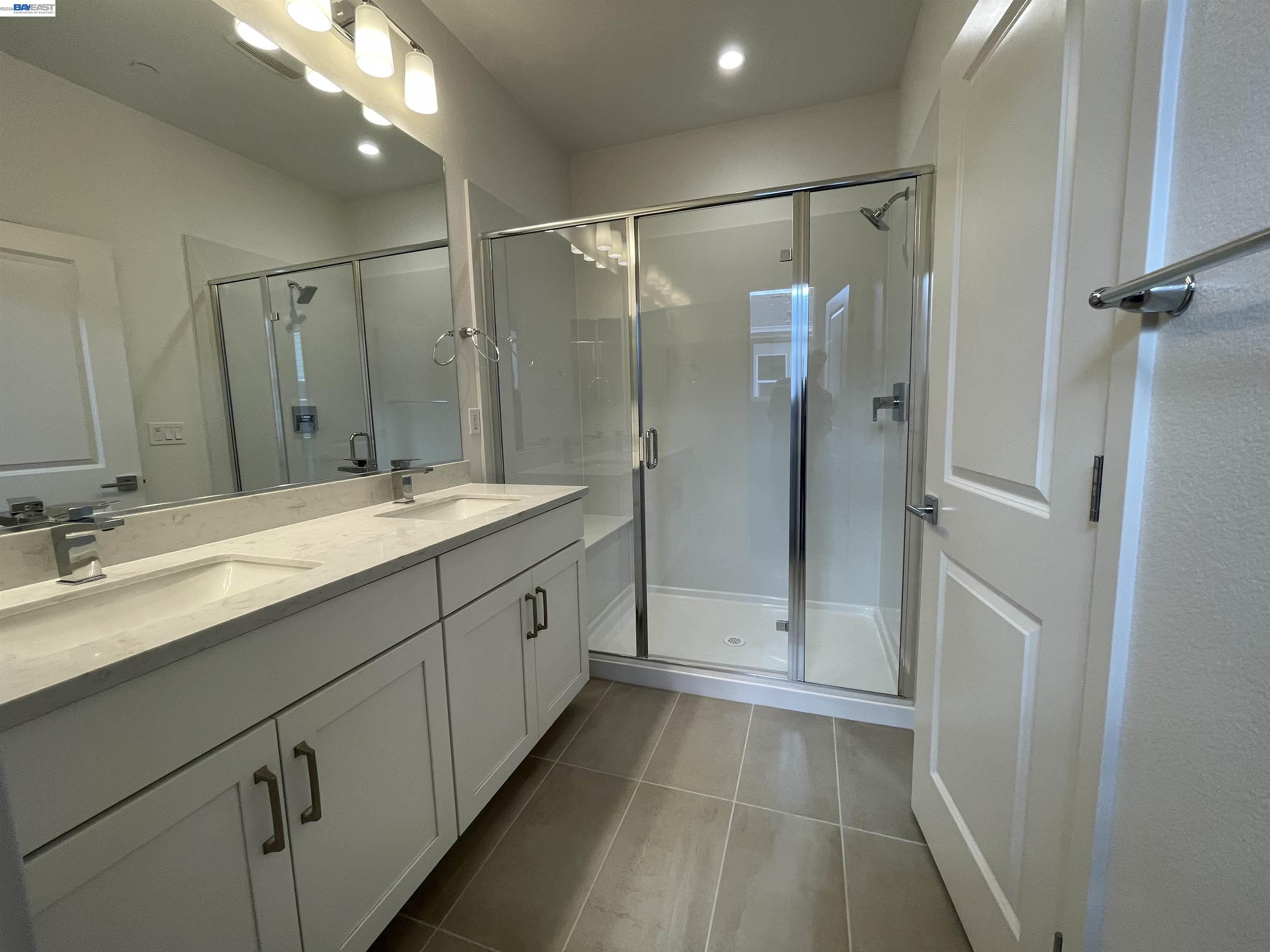 5708 Melon Court San Ramon, CA 94583 - Photo 16 of 31 a bathroom with a double vanity sink mirror and shower