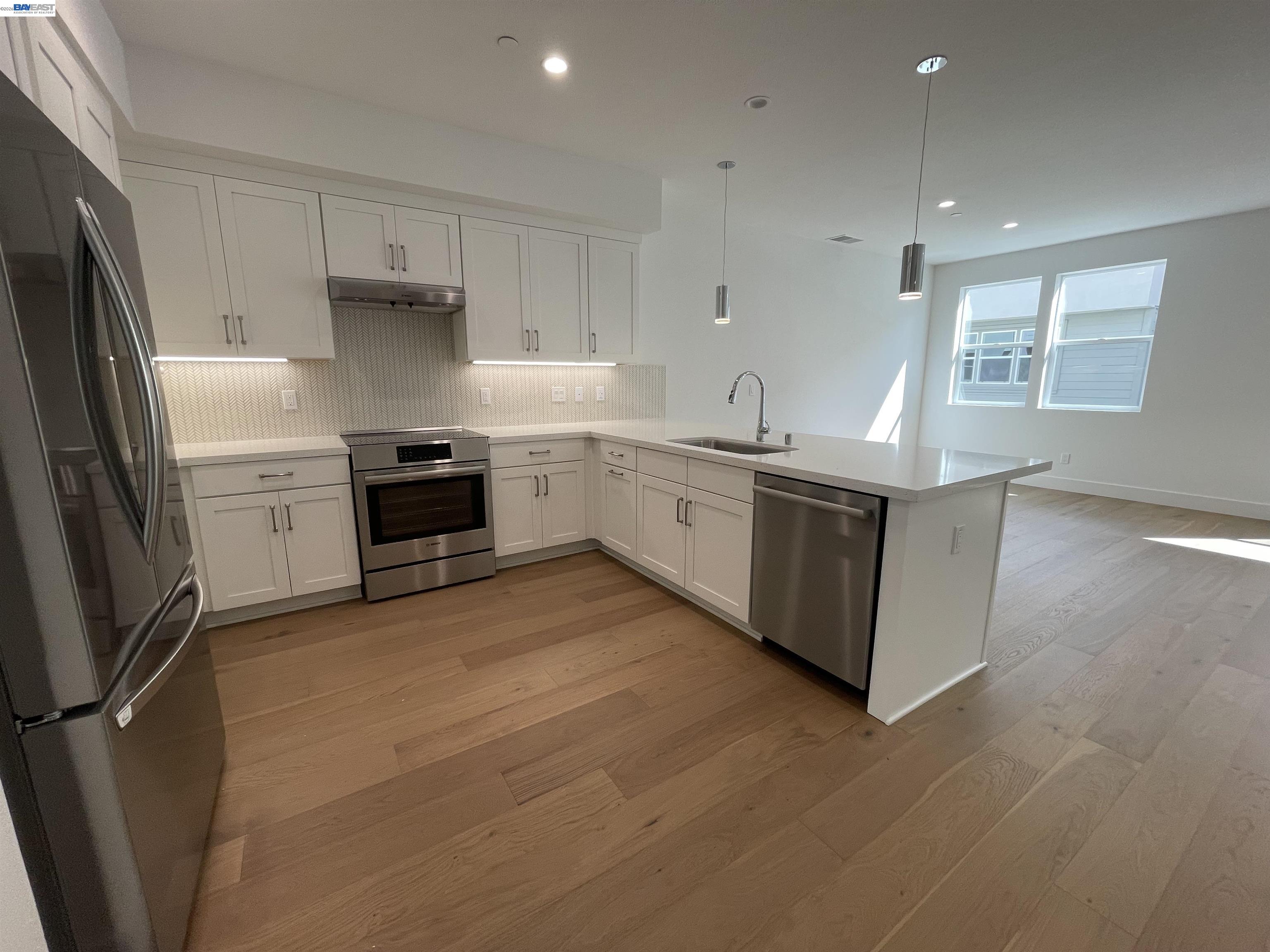 5708 Melon Court San Ramon, CA 94583 - Photo 25 of 31 a kitchen with stainless steel appliances granite countertop a stove a sink and a refrigerator
