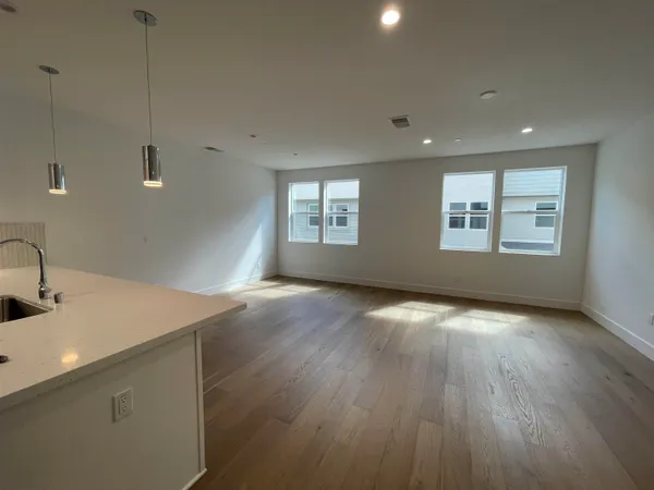 a view of a kitchen that shows a sink in it